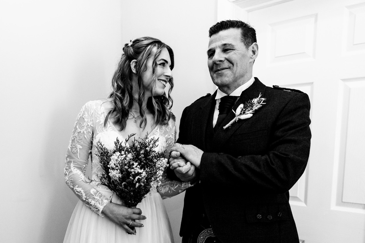Bride and her father sharing a smile before the ceremony