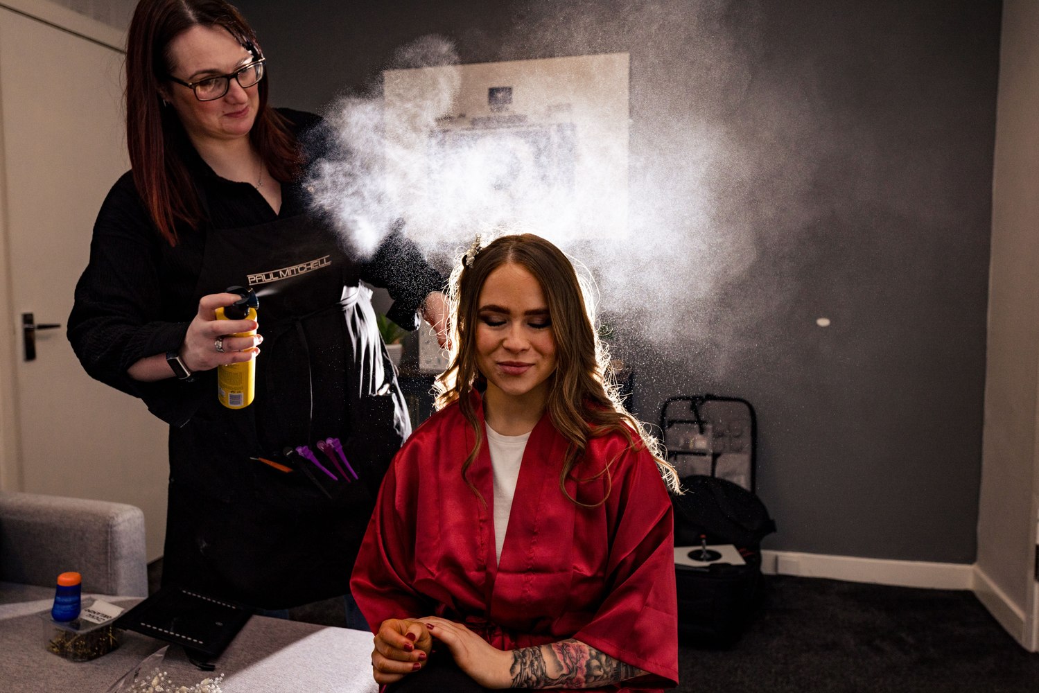 Finishing touches on the bride's hair before the ceremony