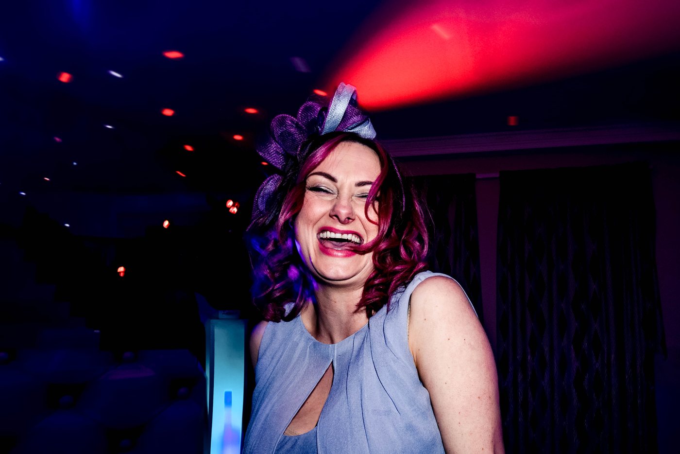 A guest caught mid laugh on the dance floor